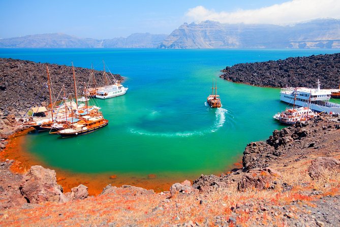 Santorini Volcano Sunset Cruise with Dinner - Hot Springs at Palea Kameni: Mud and Sulfur Waters