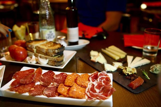 Savor Spain: Food, Wine, History & Culture Small Group Tour in Old Barcelona - Exploring Raval: Artistic Vibes and Tasty Stops
