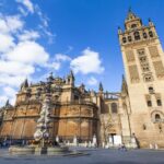 Seville: Cathedral & Giralda Guided Tour with Entry Tickets - Climbing the Iconic Giralda Bell Tower for Panoramic Views