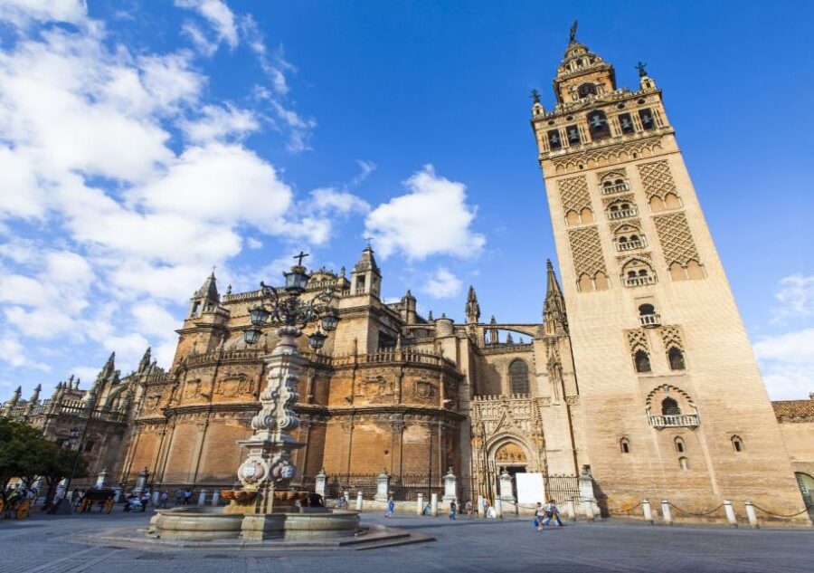 Seville: Cathedral & Giralda Guided Tour with Entry Tickets - Climbing the Iconic Giralda Bell Tower for Panoramic Views