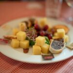 Swiss Cheese, Chocolates and Mountains Small-Group Tour from Zurich - Visiting a Typical Swiss Farm for Fresh Milk Sampling