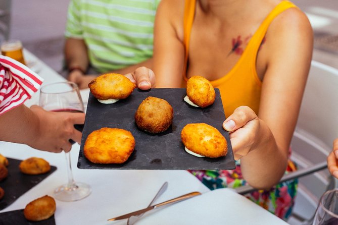 The 10 Tastings of Valencia With Locals: Private Food Walking Tour - Exploring La Lonja de la Seda and its Culinary Significance