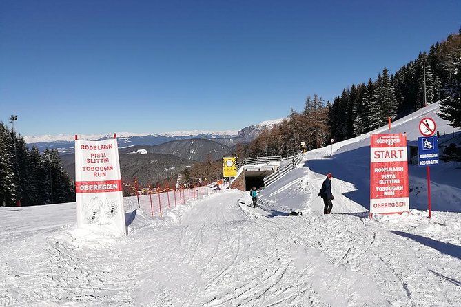The most famous sledge slope in the Dolomites and a panoramic tour by car - Sledge Your Way Down the Famous Obereggen Slope