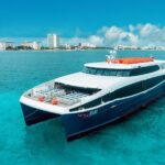 To Isla Mujeres luxury FERRY by Xcaret from Cancun - Scenic Views and Onboard Wi-Fi for Travel Planning