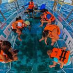 Tour Isla Mujeres excursion in Collective Transparent Boat - From the Marina to La Ca Denita Reef