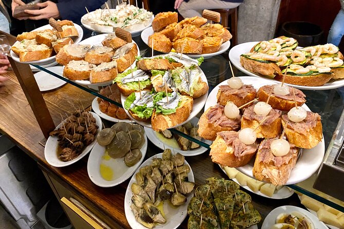 Venice Rialto Market Food Delicacies and Sightseeing Tour with a Native Guide - Crossing Venice’s Bridges and Discovering Marco Polo
