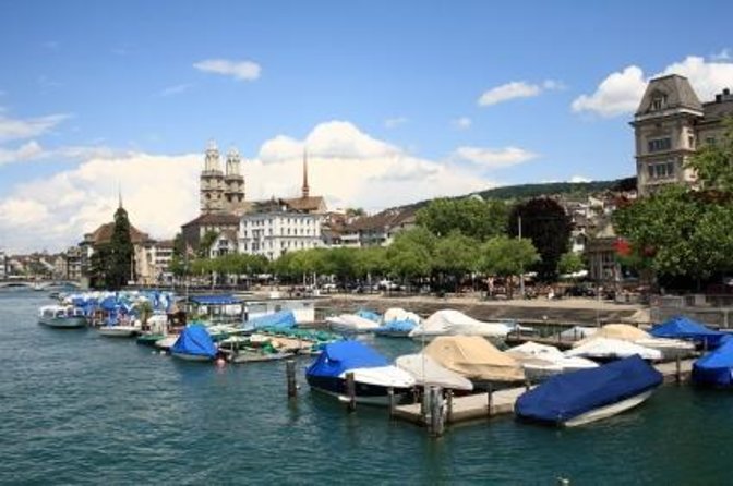 Zurich Highlights Tour With Cruise and Lindt Home of Chocolate - Coach Ride Past Zurich’s Landmark Buildings